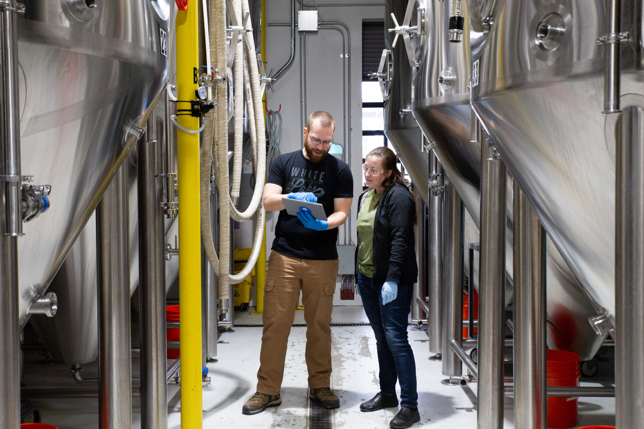 Brewery production area, staff using Ekos