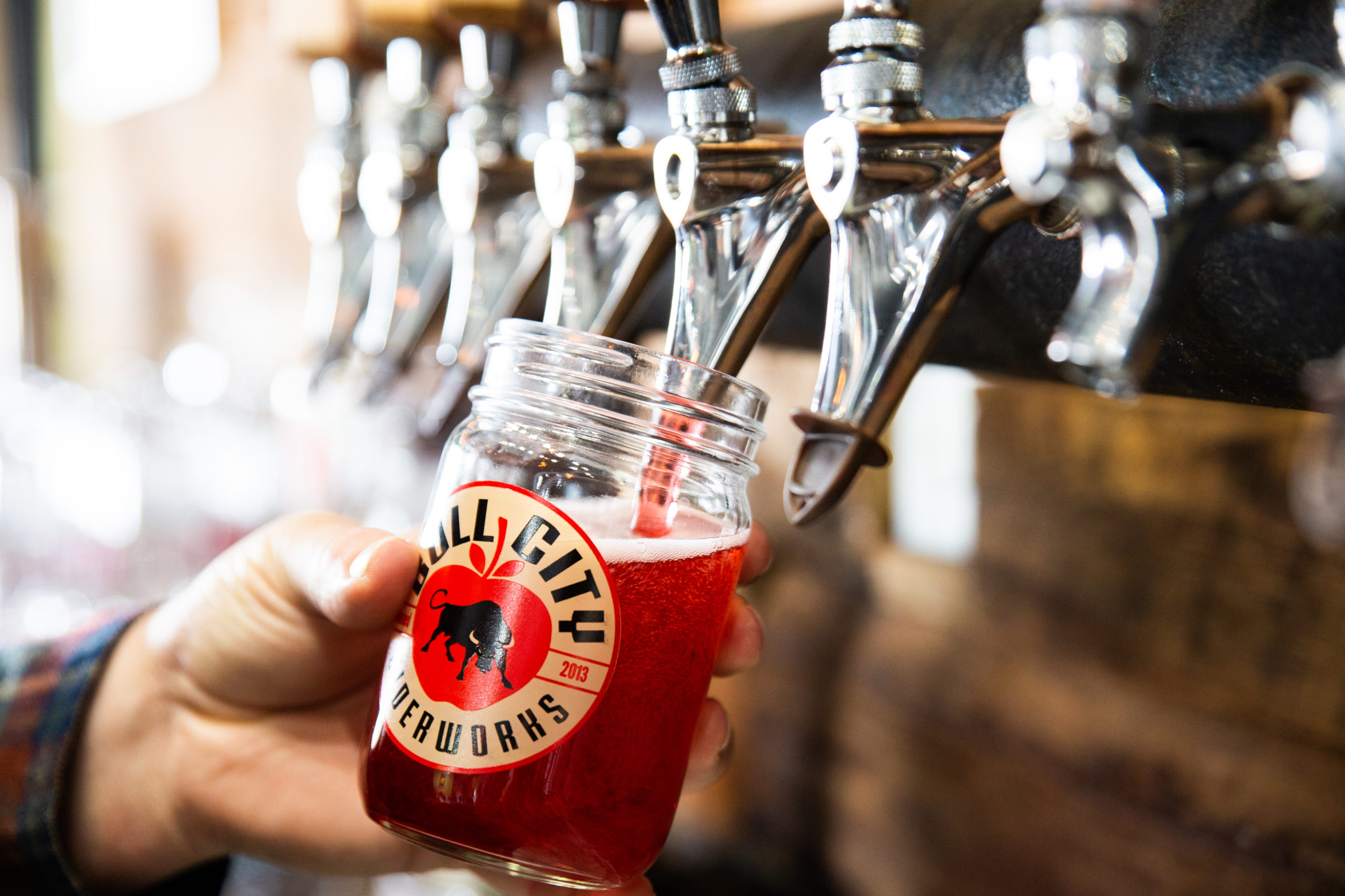 cider being poured at bull city ciderworks