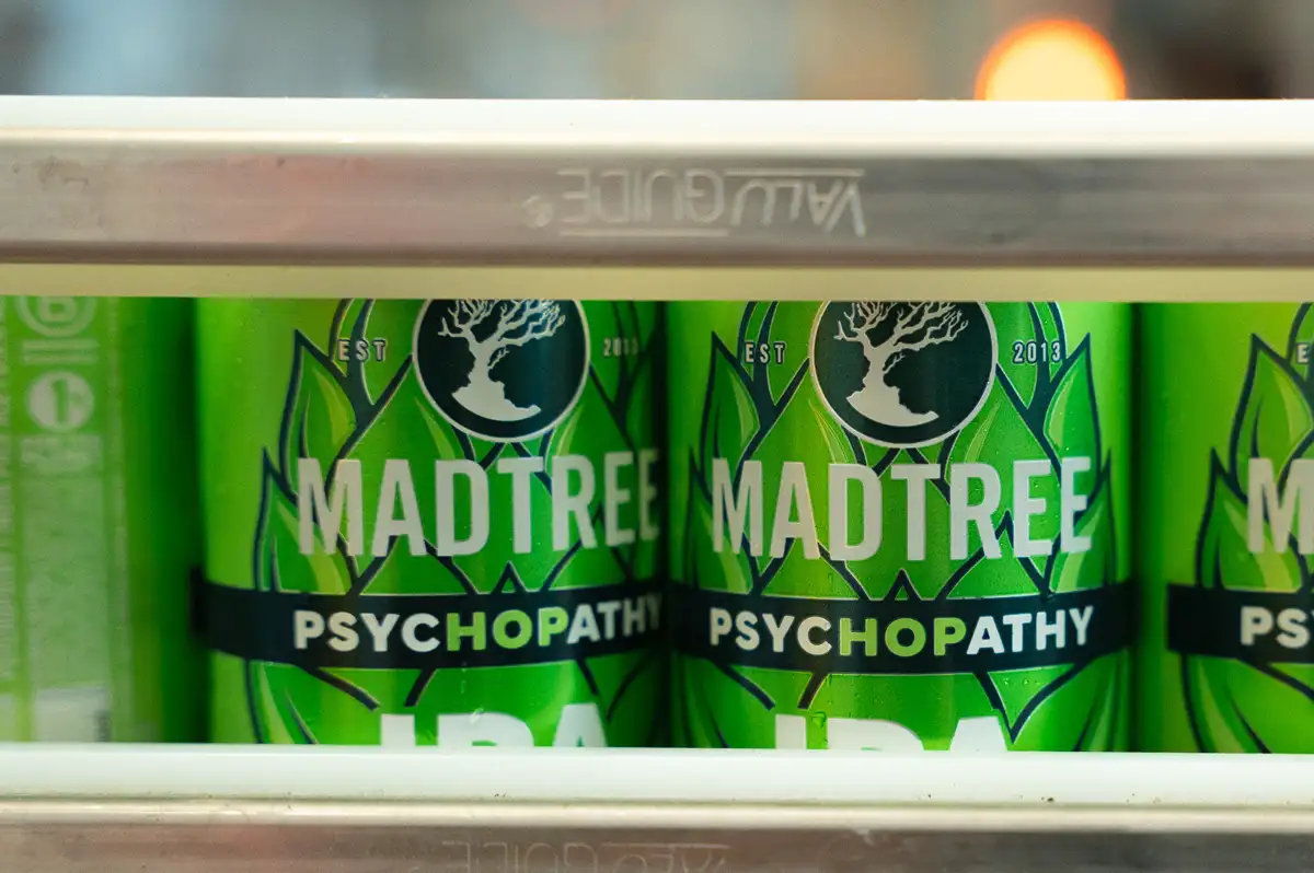 Cans of MadTree Brewing on a canning line