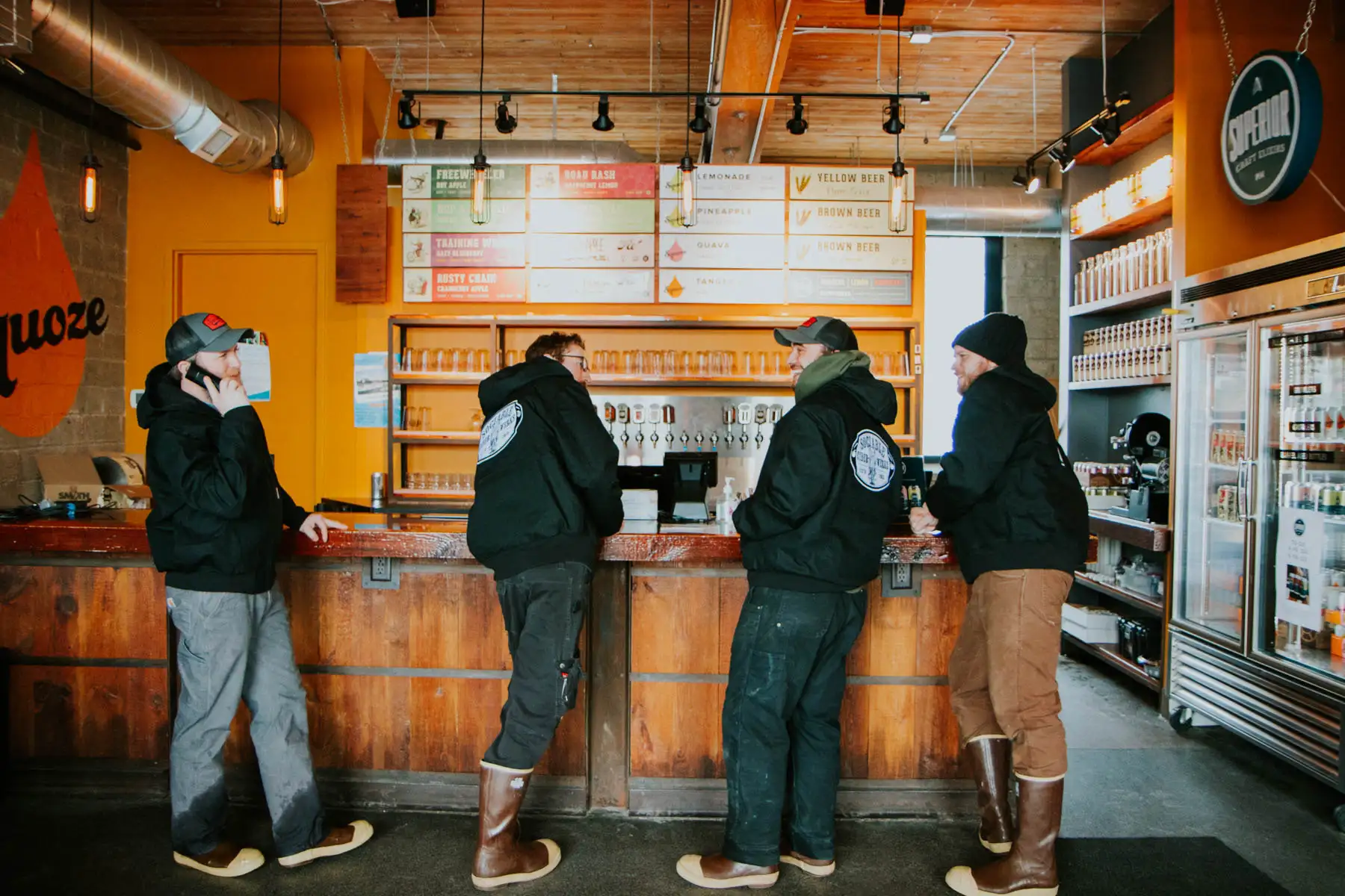 A group standing at a bar in Sociable Cider Werks