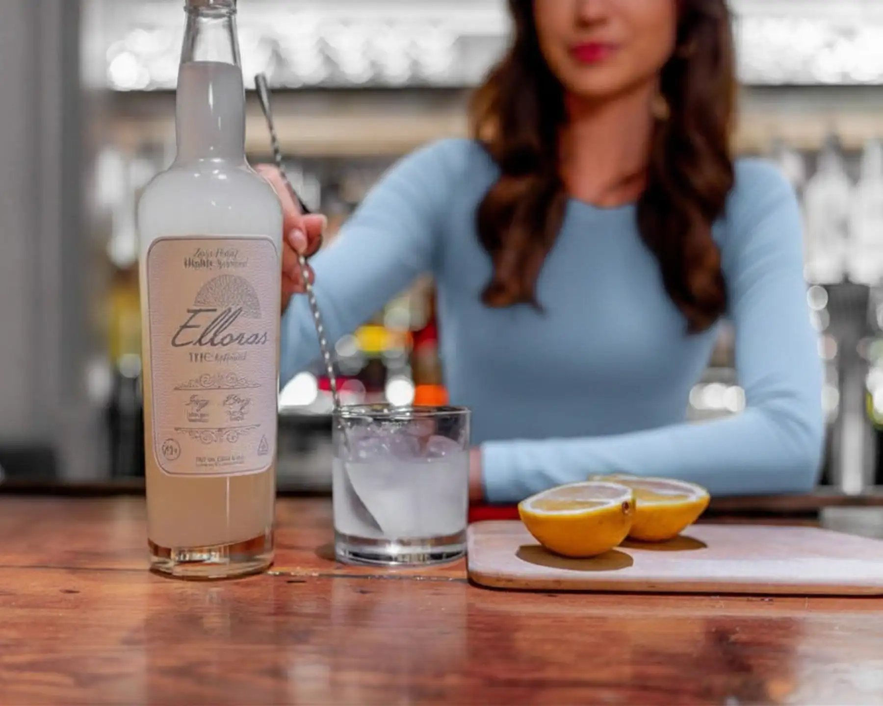 Woman stirring THC-infused seltzer